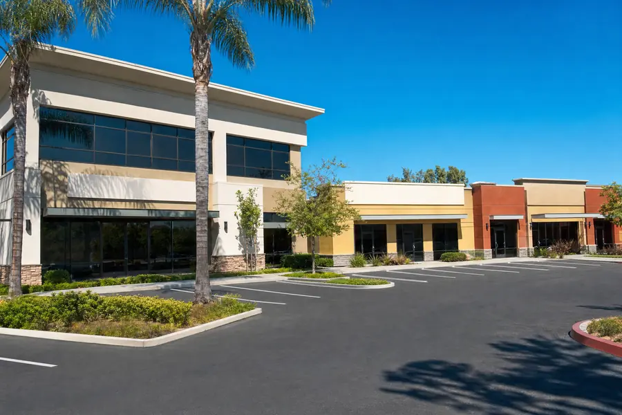 Small office building beside a retail run on a Broward commercial block
