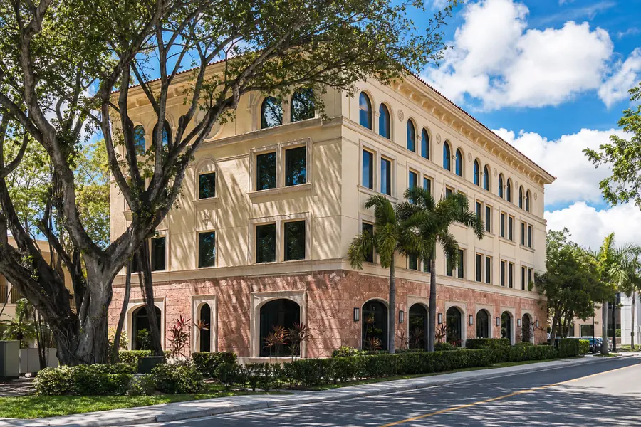 Mediterranean office building on a shaded street in Coral Gables, Florida