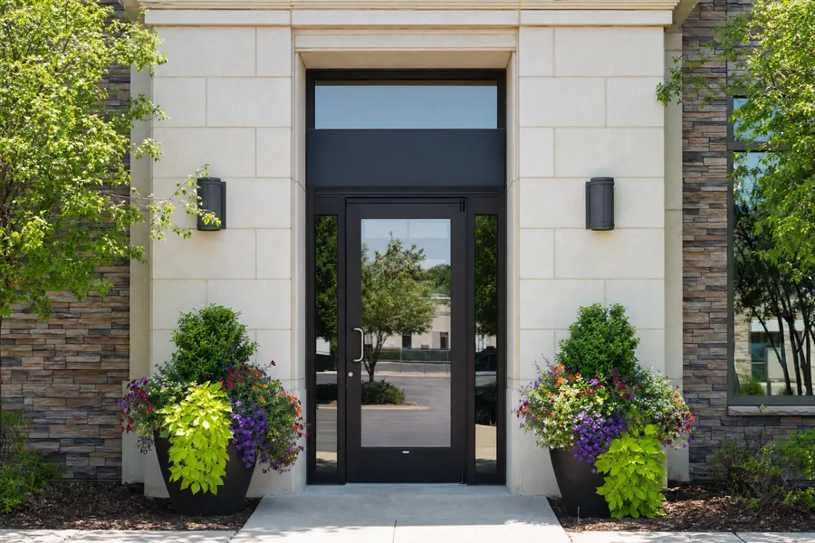 Closed glass entry door of a commercial suite