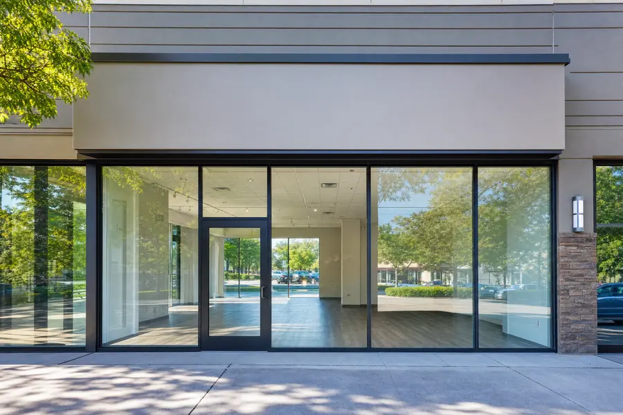 Vacant retail suite seen through its glass frontage