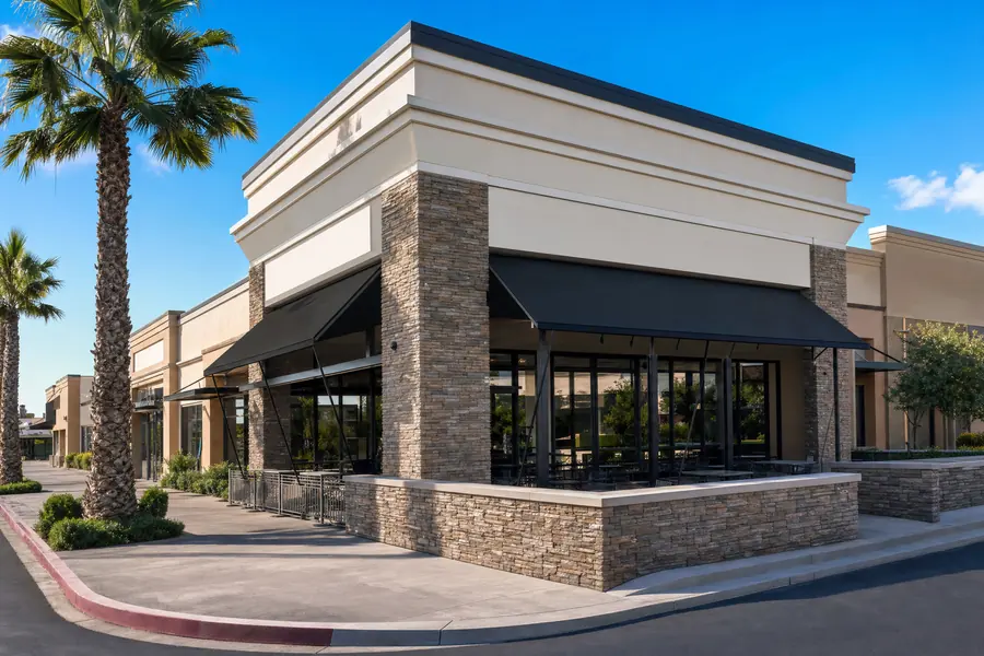 Restaurant end-cap space with a patio at a retail center