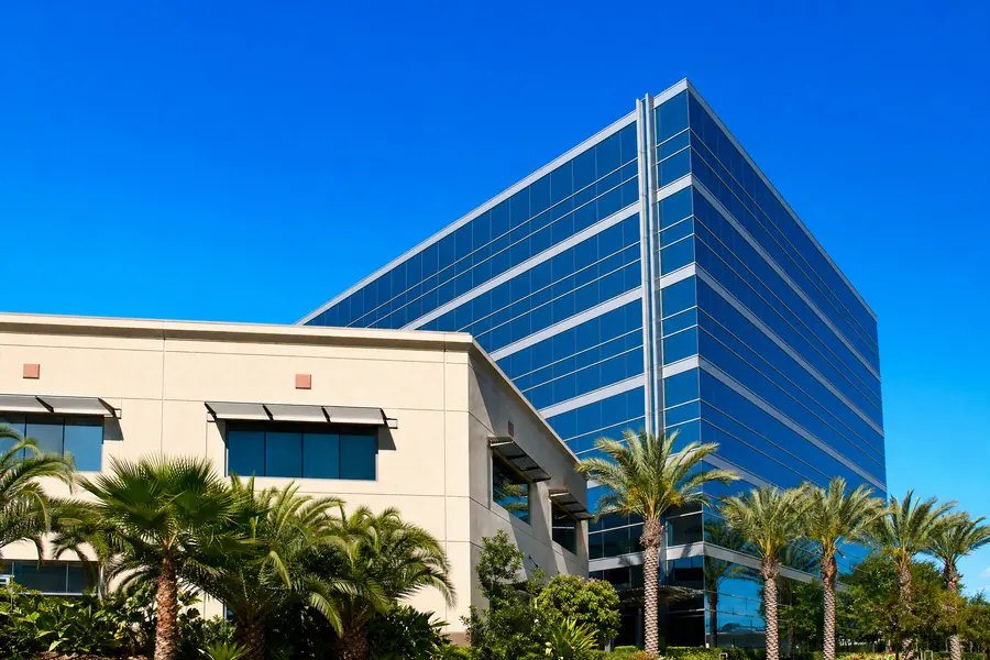 Two commercial buildings of different heights meeting at a corner