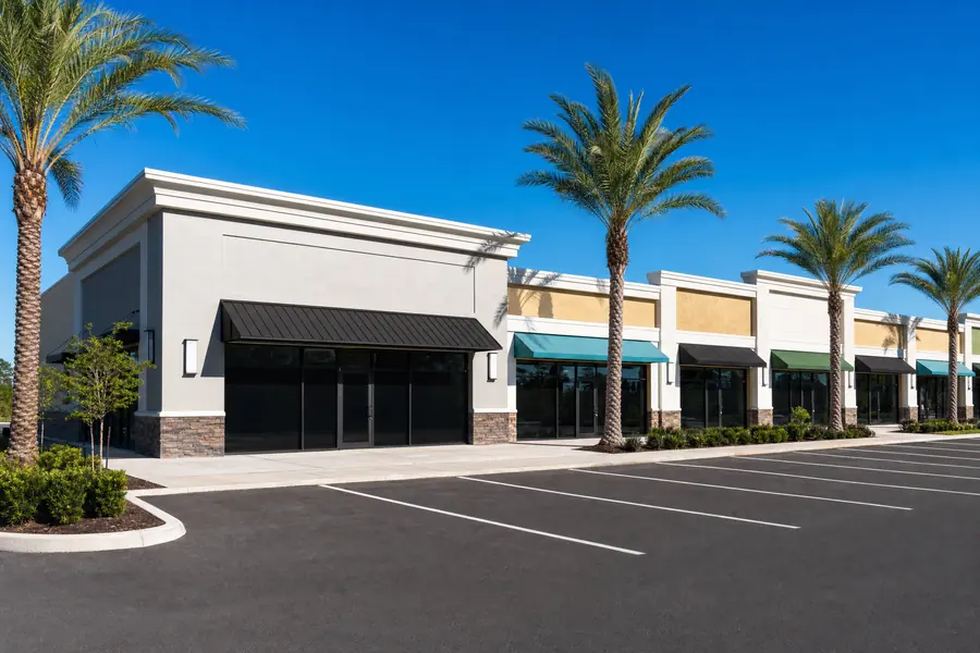 Retail center with one vacant end unit beside occupied suites
