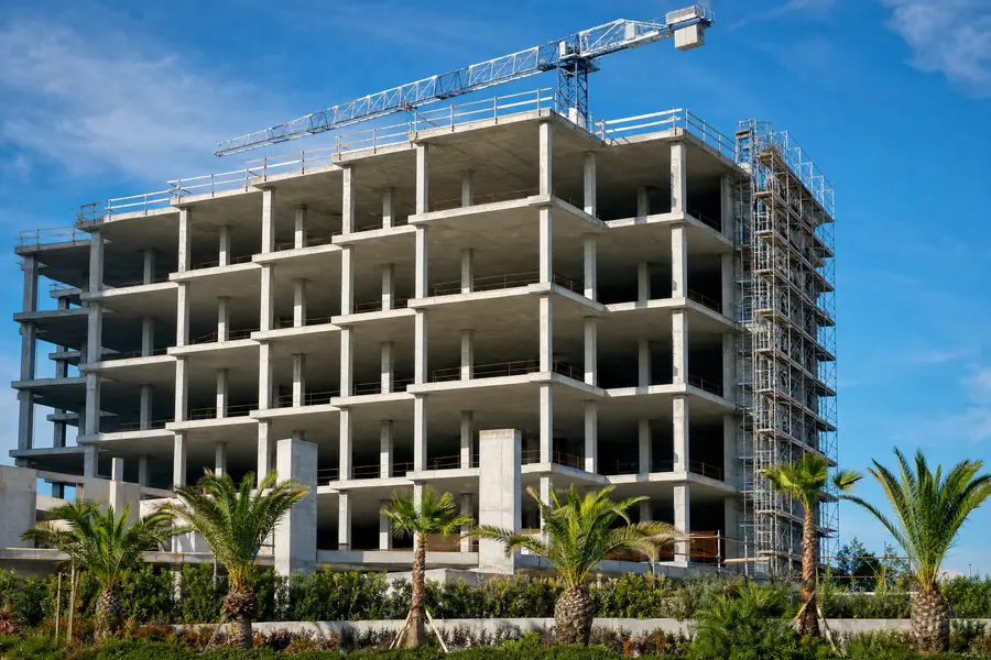 Commercial building under construction with exposed concrete frame
